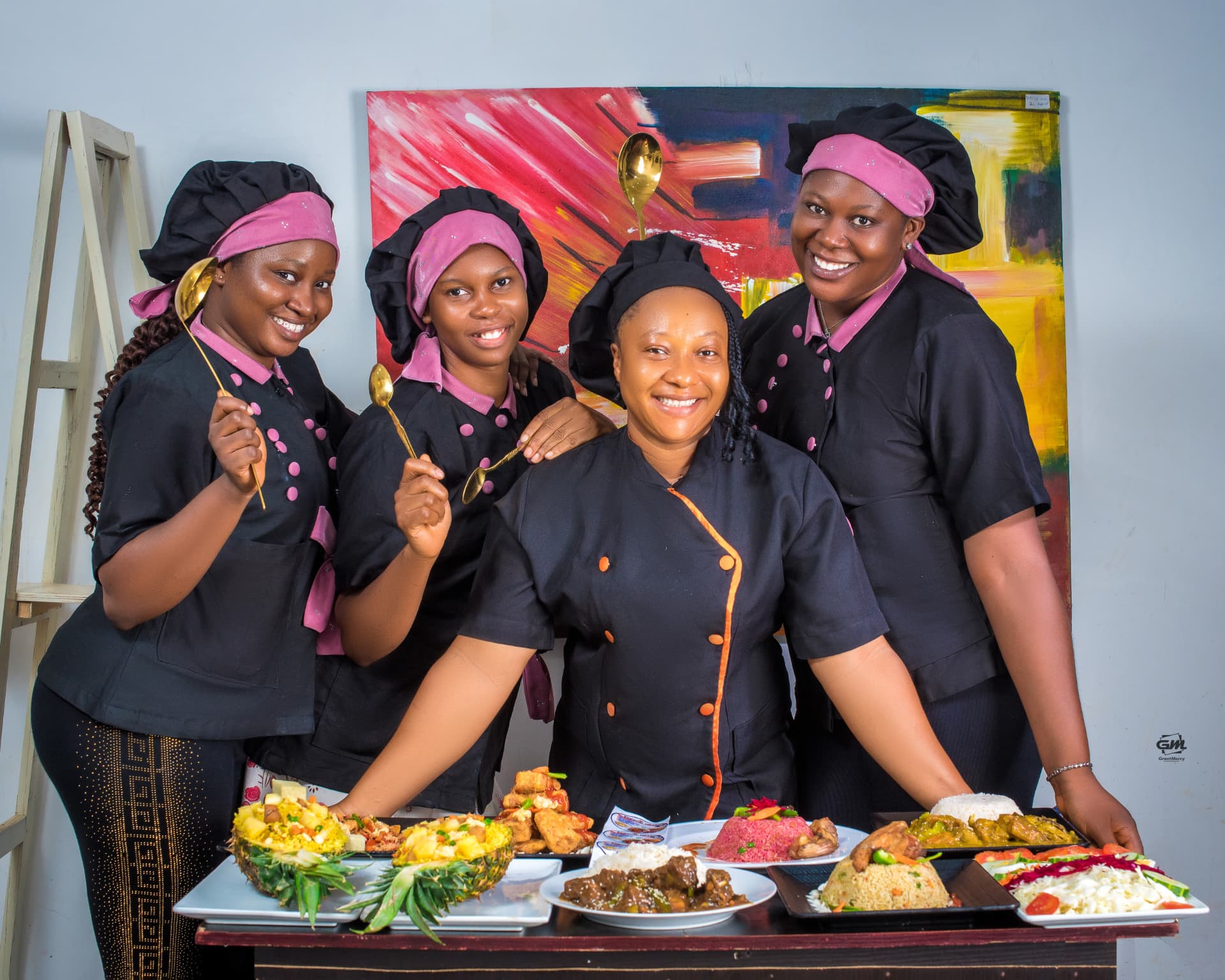 Professional chefs and students of Essential Catering & Skill Academy presenting Nigerian dishes